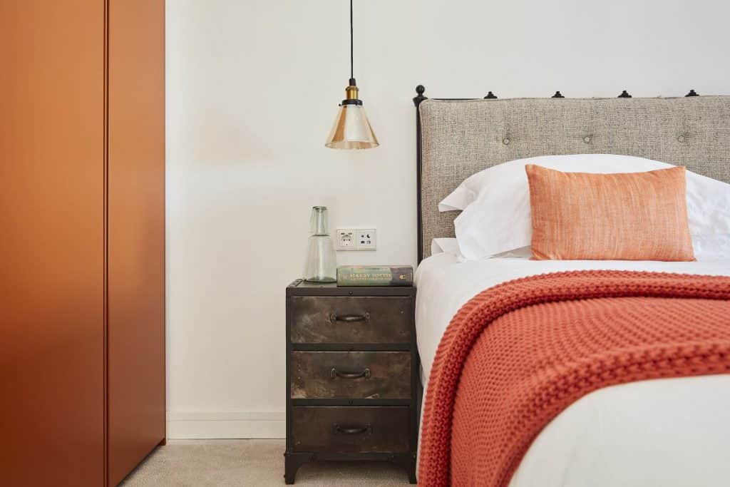 Caramello coloured poliform wardrobes with metal bedside tables in Bonaire Villa, Majorca.