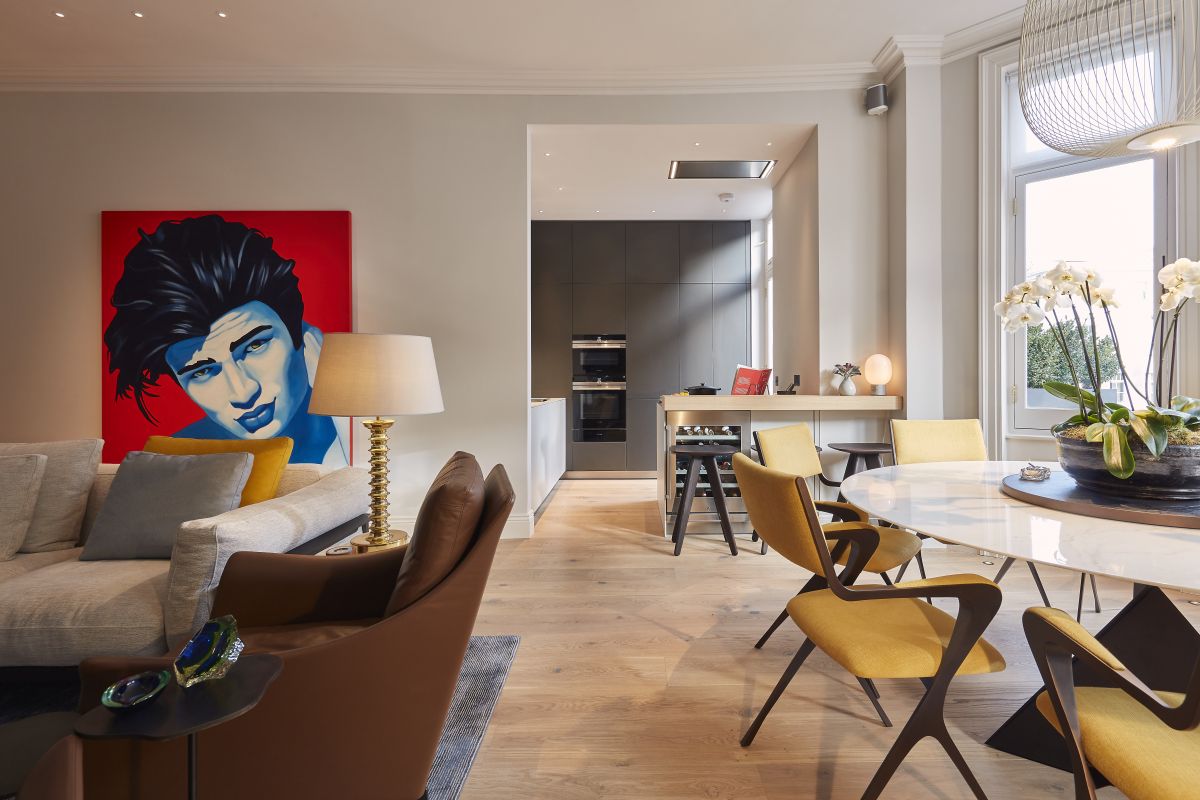 havwoods wooden flooring in large open plan living kitchen dining room with bulthaup kitchen and Tom Faulkner dining table with wooden Lazy Susan.