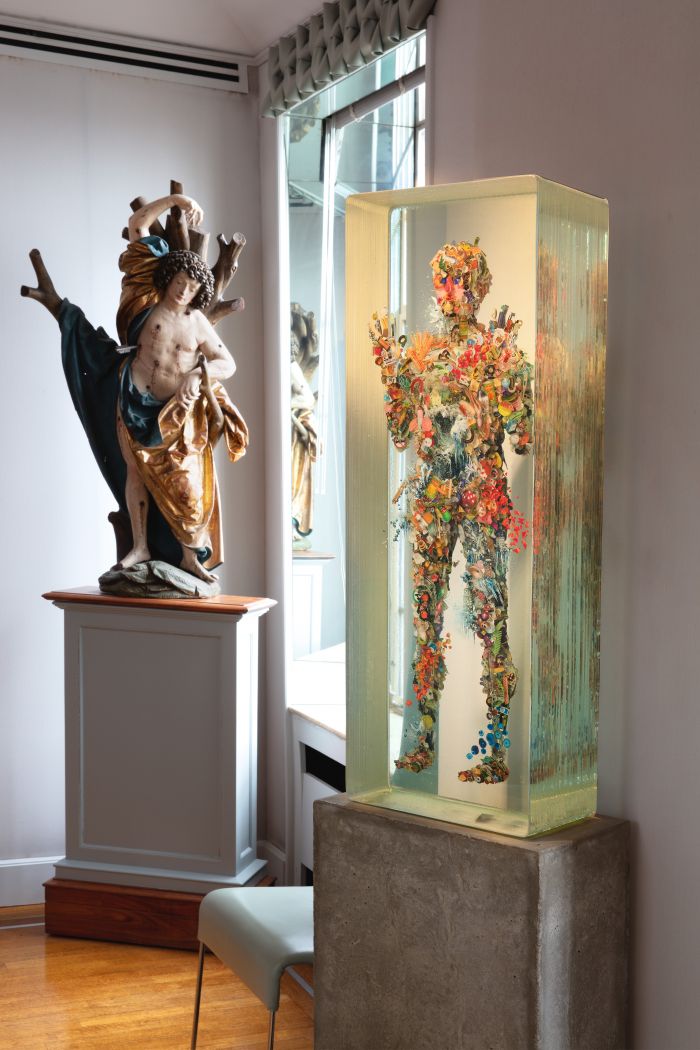 Contrasts seen in the collection of Hester Diamond: a sculpture by 16th century German artist Jorg Lederer next to a contemporary piece by Dustin Yellin.