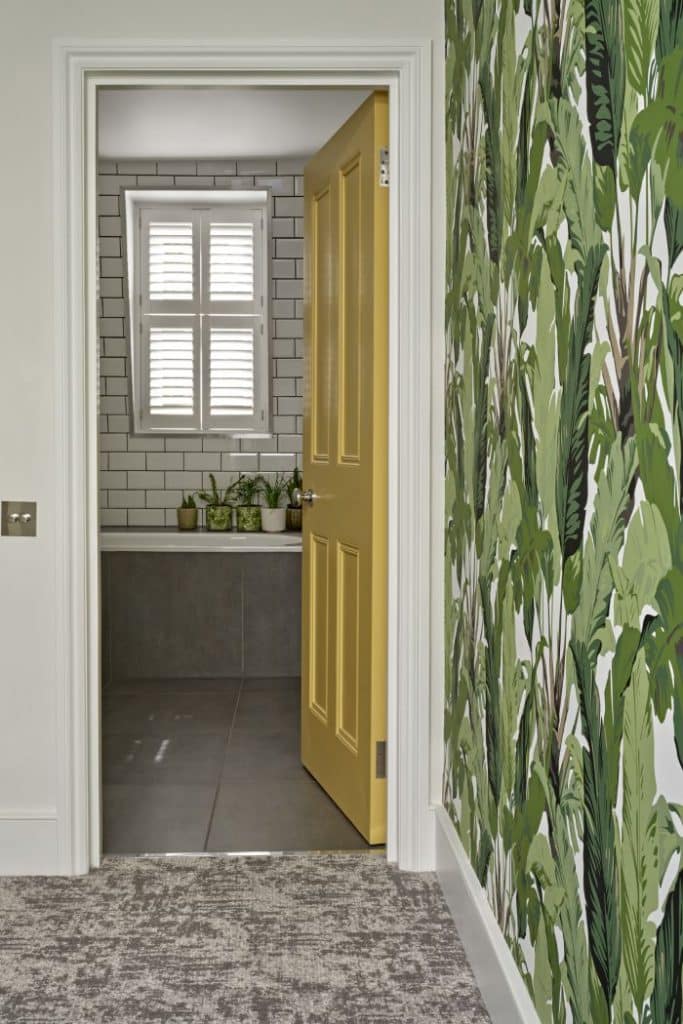 Bright patterned wallpaper in hallway.