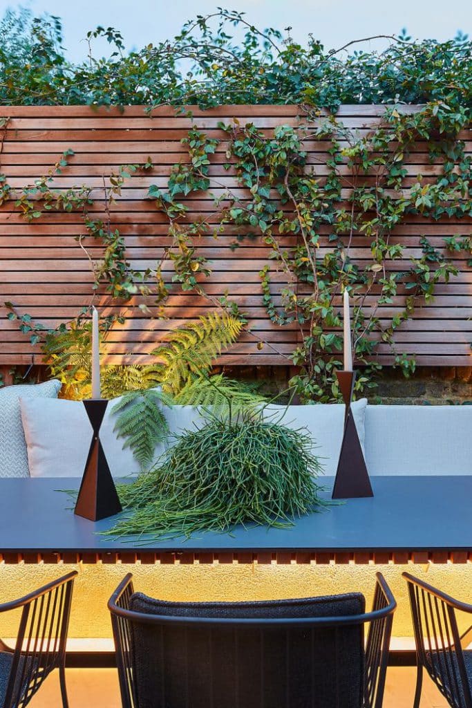 Outdoor dining area with outdoor fabrics from Mark Alexander and garden design from Bartholomew Landscaping.