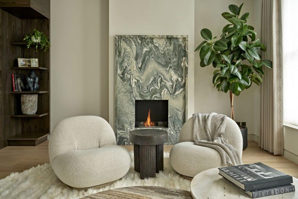 Statement green marble fireplace being the focus point of the room.