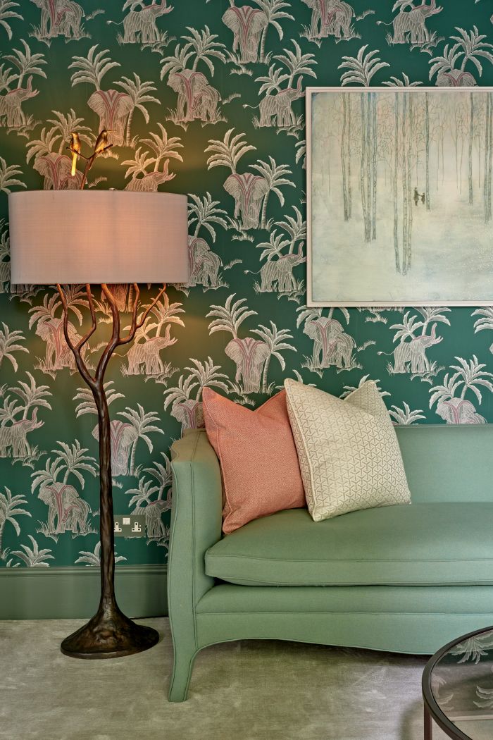 Eclectic living room with bold pattern wallpaper. 