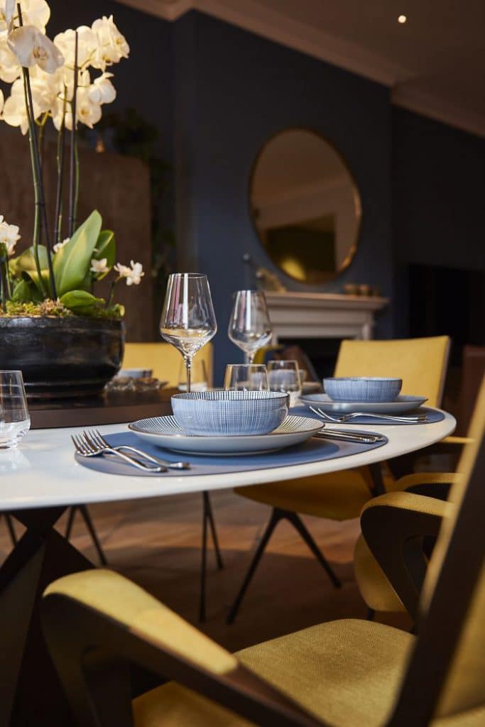 A round carrara marble dining table with lazy susan.