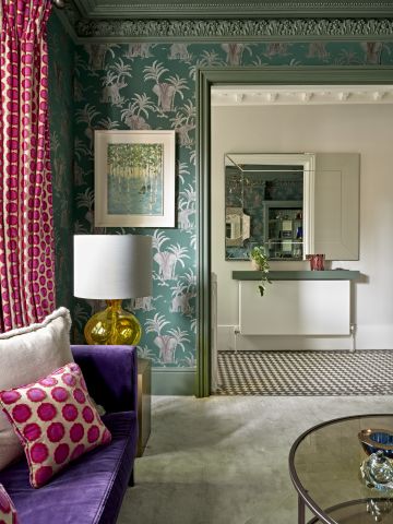 Eclectic living room leading to a period entrance hallway.