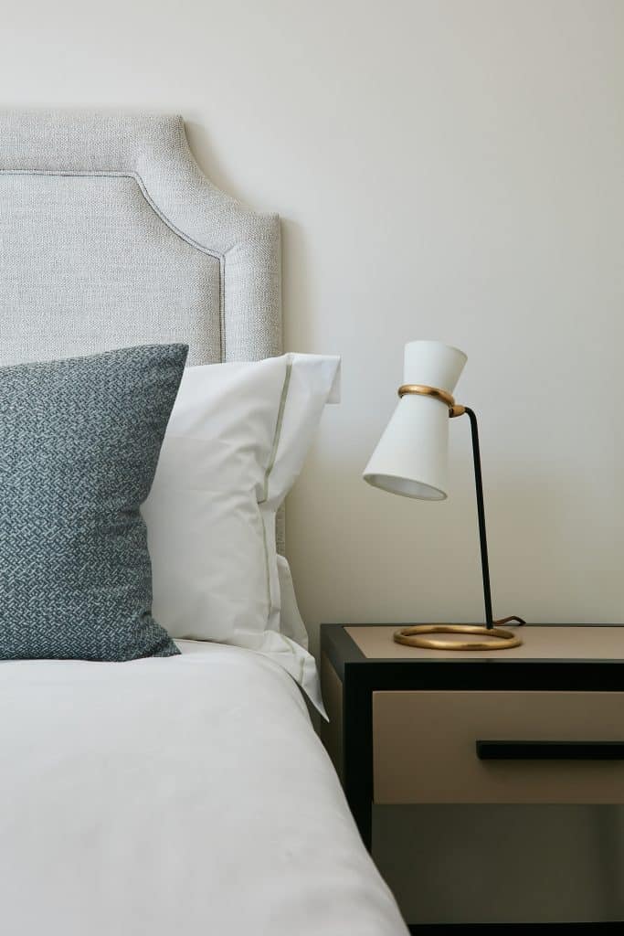 Bedside table lamp with brass hardware.