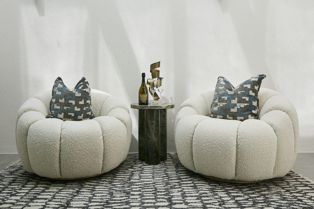 Pair of neutral armchairs in hallway.