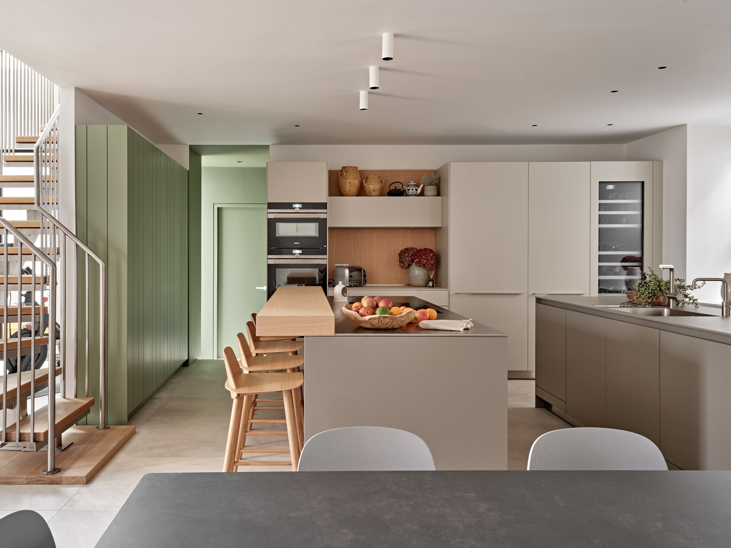 neutral tone modern kitchen with breakfast bar.