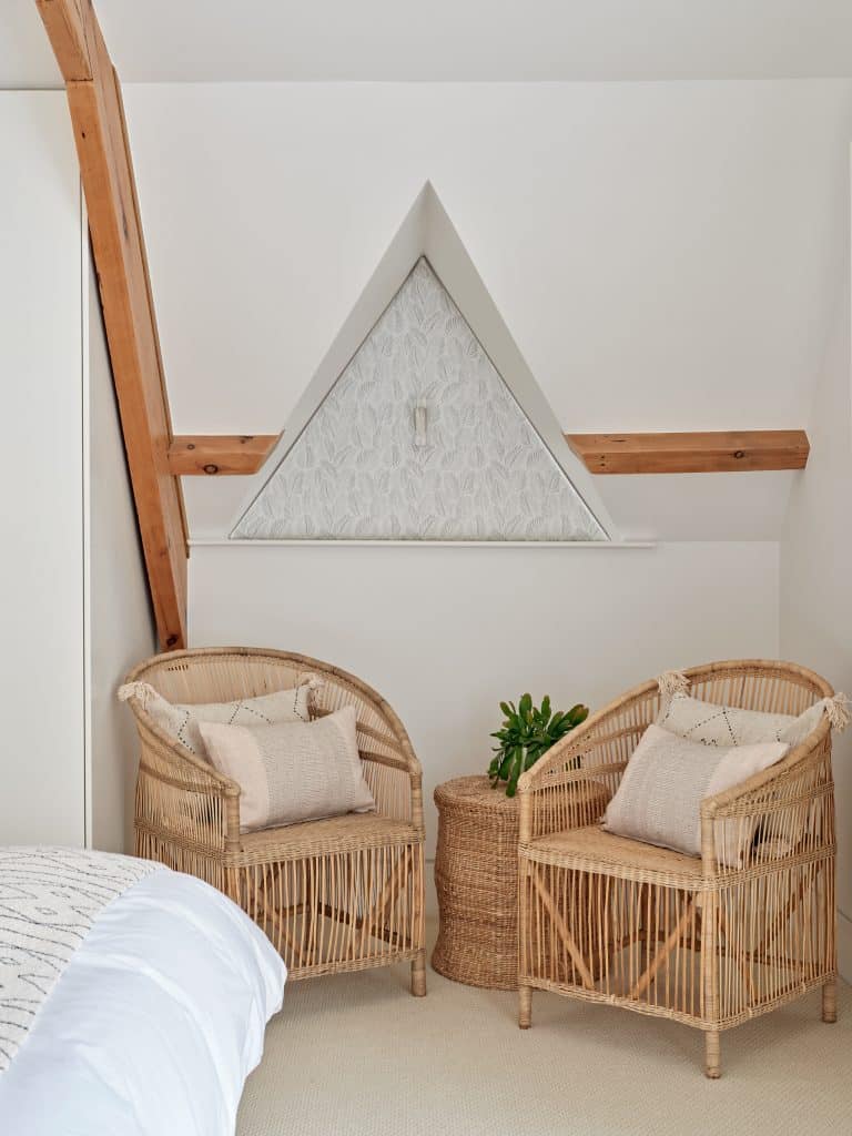 Rattan seating in neutral bedroom.